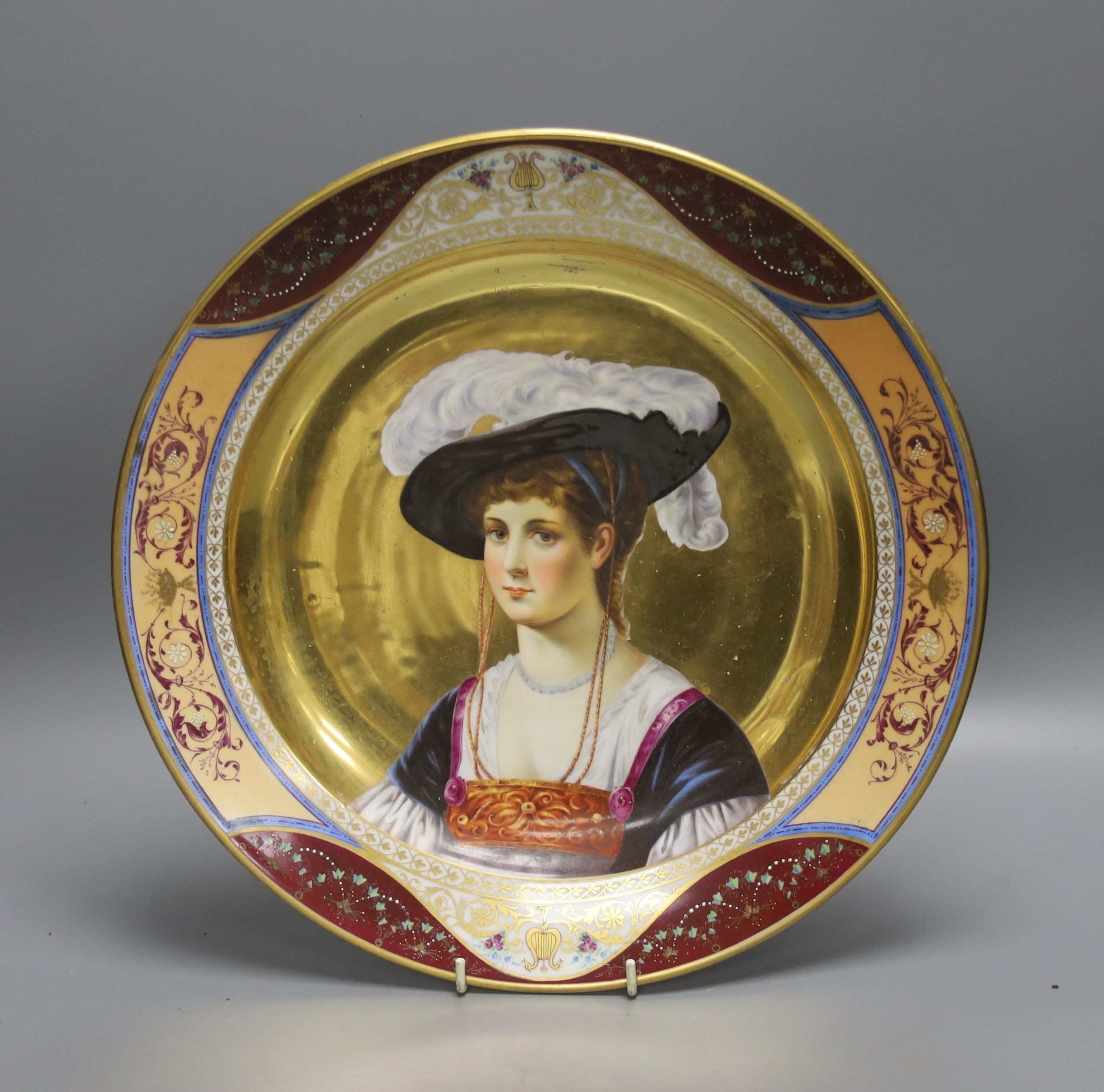 A 19th century Dresden porcelain charger, painted with a portrait of a lady, Augustus Rex mark verso, 36cm diameter.
